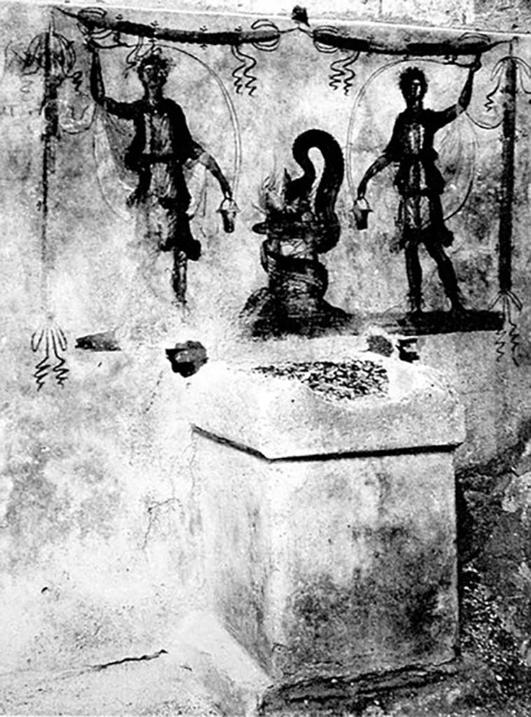 Pompeii, street altar on west side wall of I.11.1. Old photo c. 1915.
Two large Lares were on the sides of a painted altar.
Each held a cornucopia and a situla (bucket).
A serpent coiled around the painted altar with its head in the fiery offering.
A garland was above each and one hung down each side.
See Fröhlich, T., 1991. Lararien und Fassadenbilder in den Vesuvstädten. Mainz: von Zabern. (F7, Taf 53,1).