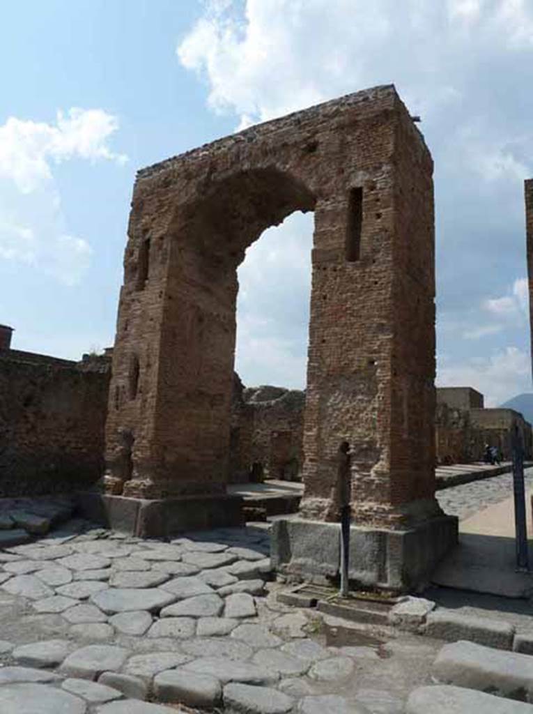 Arch of Caligula. May 2010. Looking north from arch at the start of the Via Mercurio. A bronze equestrian statue was found in pieces beneath the arch. This was (arbitrarily) identified as being Caligula and may have come from the top of the arch. Now in Naples Archaeological Museum. Inventory number 5635.
According to Welch, the statue wore a toga and senatorial sandals and was realistically portrayed as middle aged. She suggested it was more likely to be a high ranking civic person. She suggested that it may be have been Marcus Tullius who was tribunus militum a populus a non military but equestrian rank. He was also the donor of the adjacent Temple of Fortuna Augustus in the Augustan period.
See Welch K. E. in Dobbins, J. J. and Foss, P. W., 2008. The World of Pompeii. Oxford: Routledge. (p.551-554, fig. 36.2a-c).