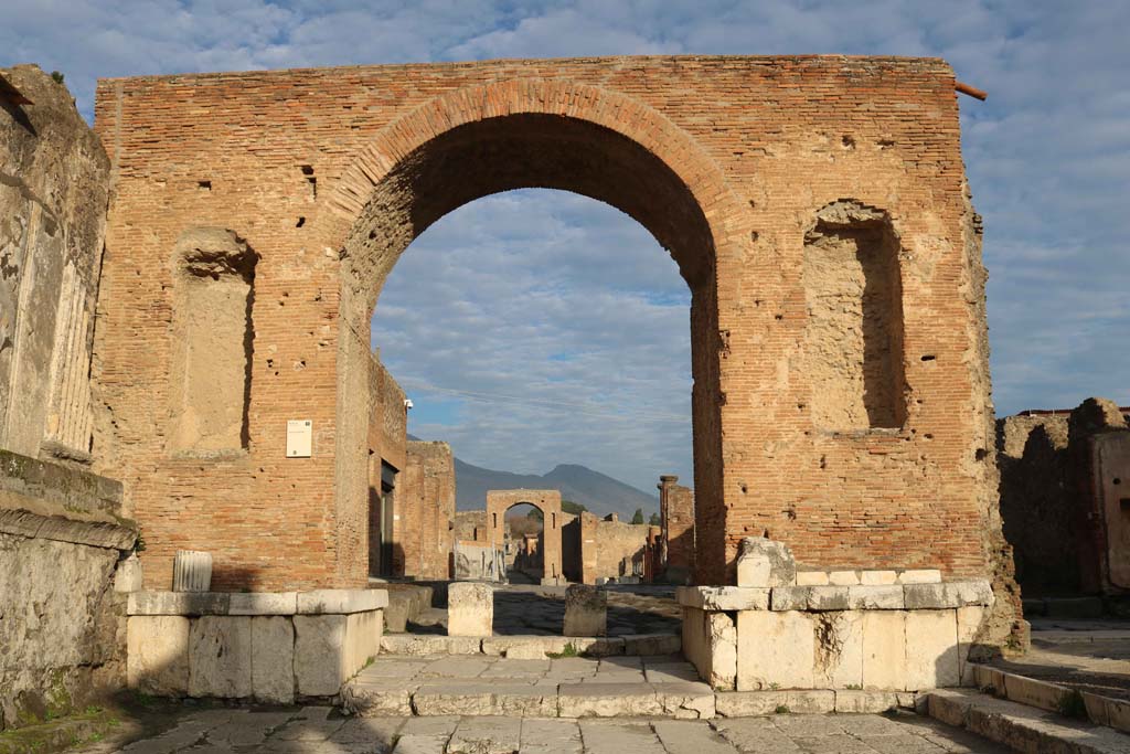 Arch at north-east end of the Forum. December 2018.
Looking north through arch towards Via del Foro, and on to arch at junction with Via di Mercurio. Photo courtesy of Aude Durand.