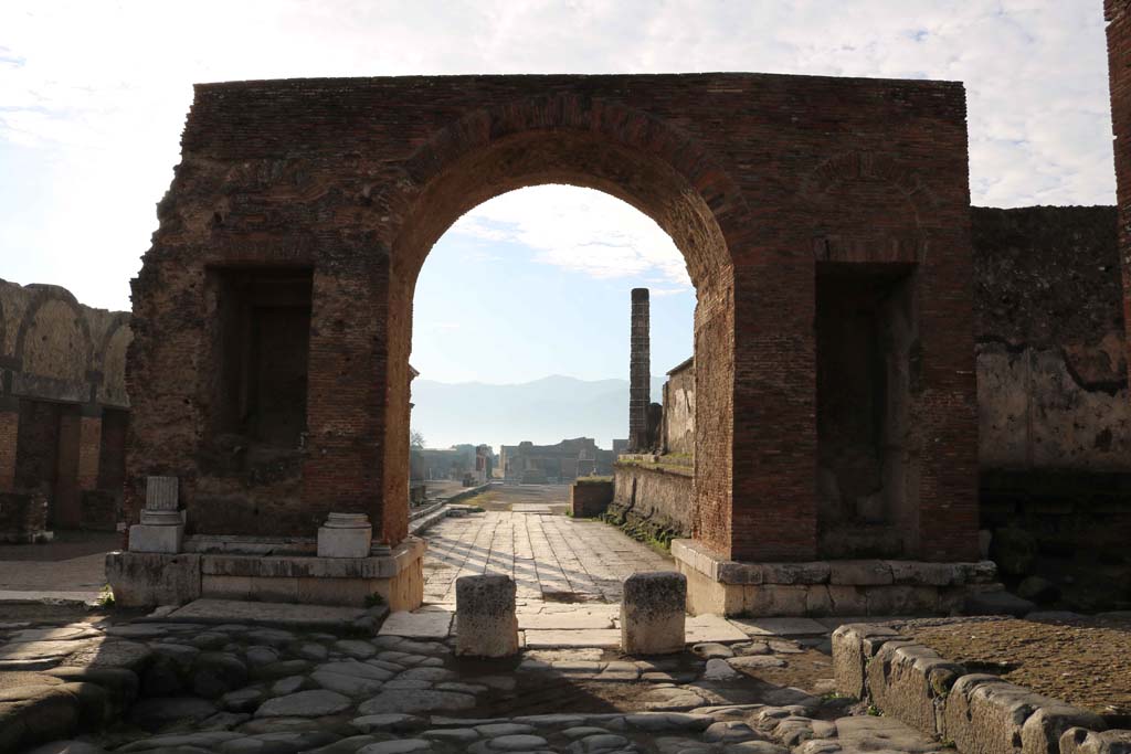 Arch at north-east end of the Forum. December 2018.
Looking south from Via del Foro, into the Forum. Photo courtesy of Aude Durand.