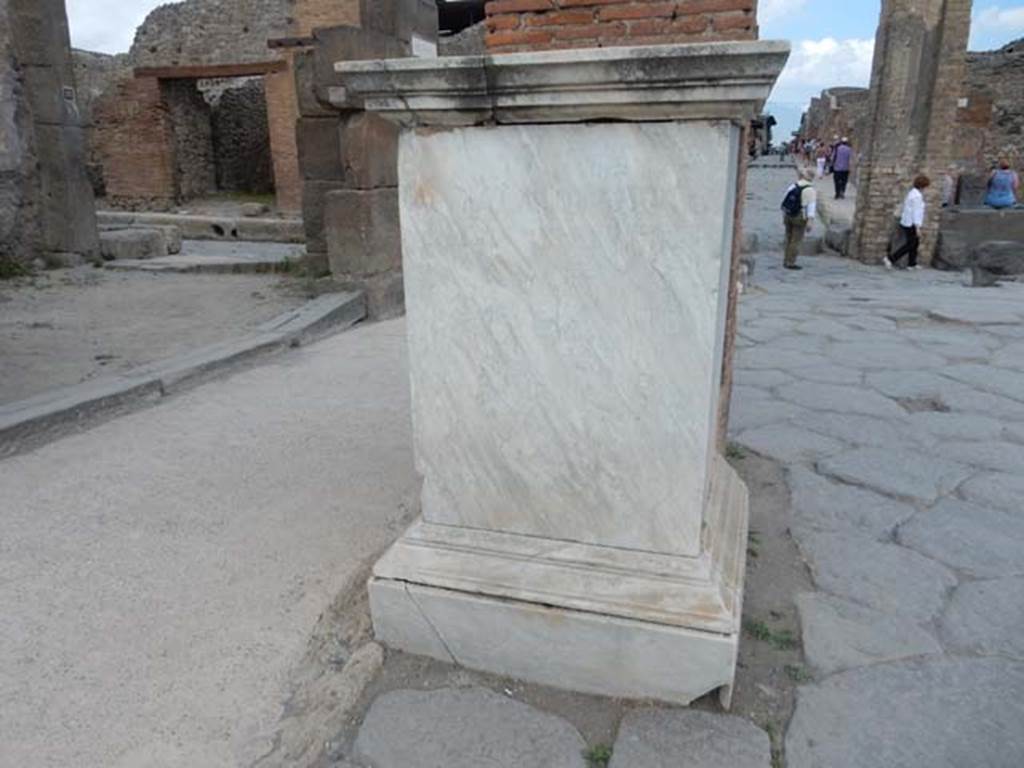 Arch of Marcus Holconius Rufus. May 2017. Marble statue base with inscription to Marcus Holconius Rufus. Photo courtesy of Buzz Ferebee.