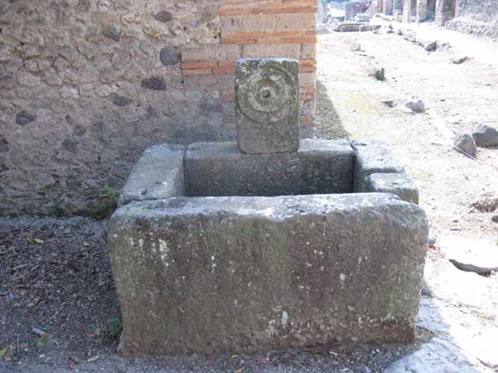 Fountain at corner of I.5.2, Pompeii. Looking west along Vicolo del Conciapelle, toward Via Stabiana. Photo courtesy of Drew Baker. September 2010.
