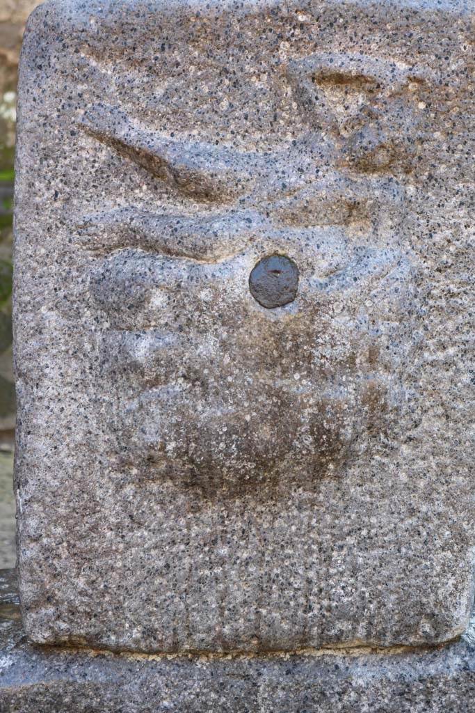 Fountain outside I.12.2 on Via dell’ Abbondanza. December 2018.
Pilaster with relief of Satyr on rock-fountain or water source. Photo courtesy of Aude Durand.