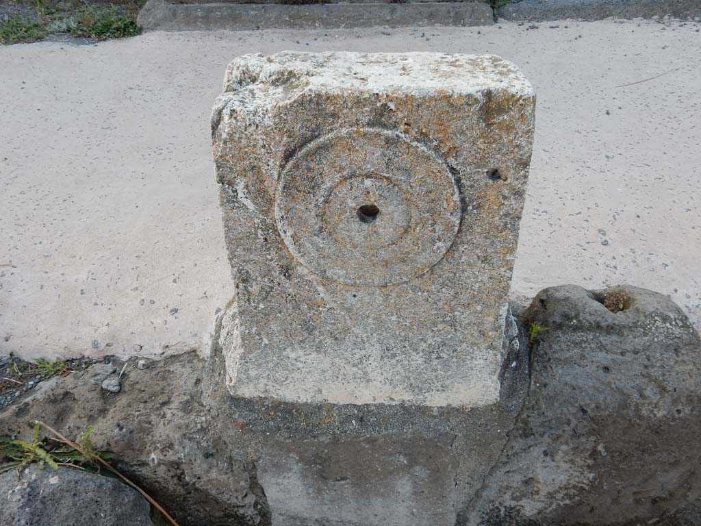 V.1.3 Pompeii. June 2019. Looking north at fountain between V.1.3 and V.1.4. with detail of relief of “patera” or plate.
Photo courtesy of Buzz Ferebee.