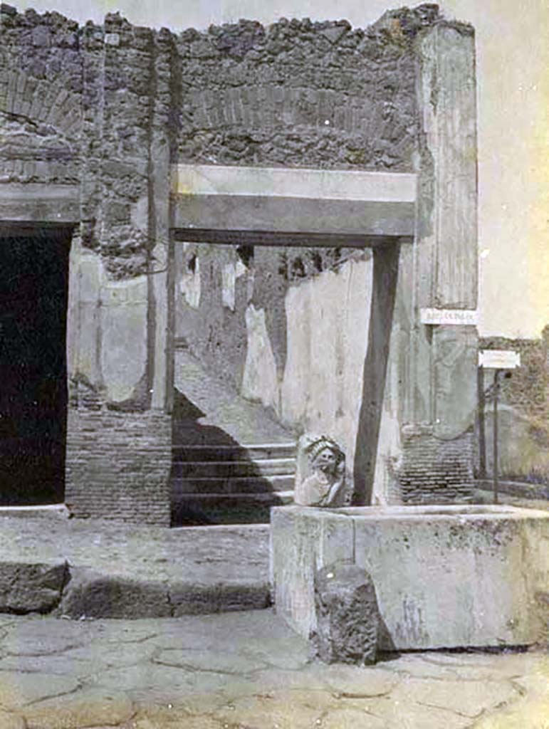 VII.9.67 Pompeii, 5th June 1925.
Looking north on Via dell’Abbondanza towards fountain and rear steps at VII.9.67. Photo courtesy of Rick Bauer.