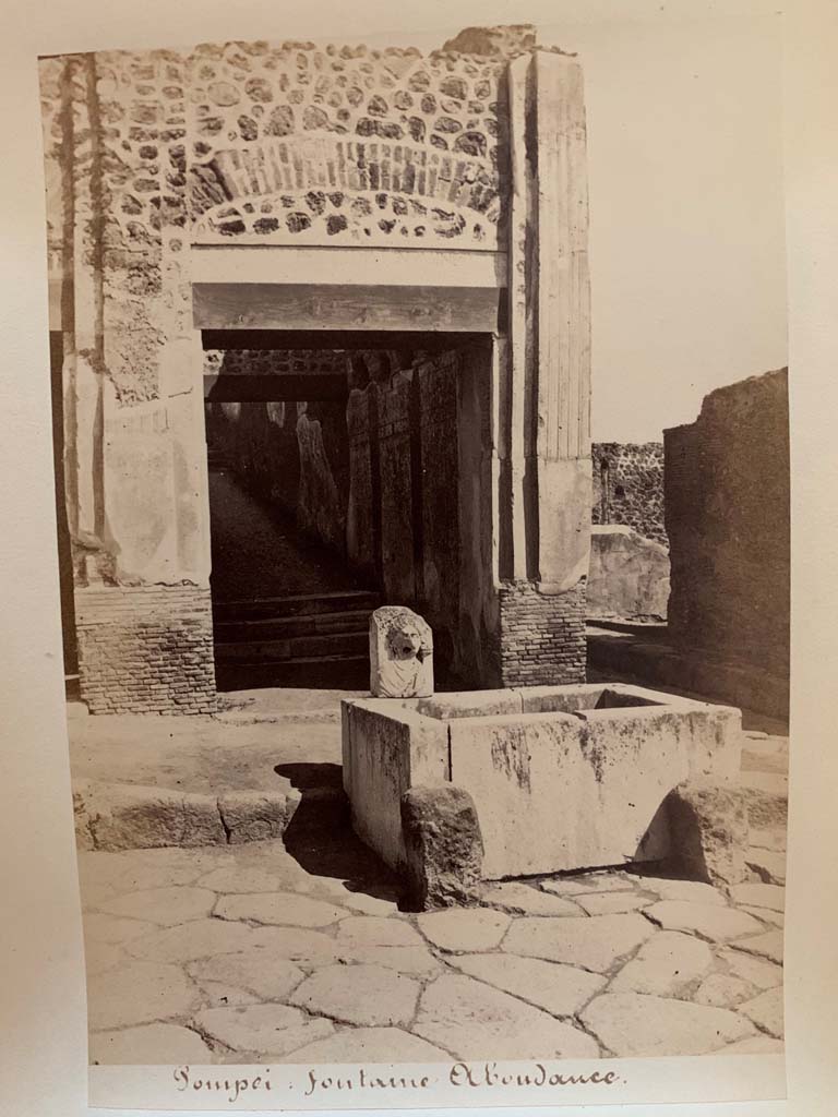 VII.9.67 Pompeii. Photograph by M. Amodio, from an album dated April 1878.
Looking north on Via dell’Abbondanza towards fountain. Photo courtesy of Rick Bauer.