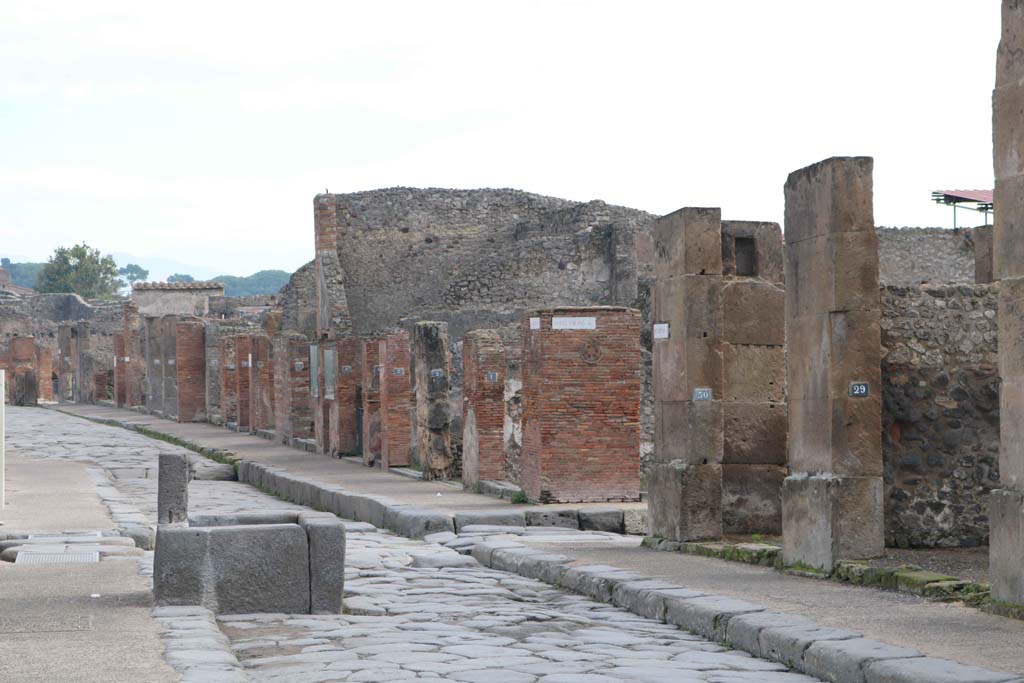 Fountain outside VII.14.13 and VII.14.14 on Via dell’Abbondanza, south side, Pompeii. December 2018.
Looking east towards junction with Via dei Teatri, and Insula VIII.4, on left and VIII.5, on right. Photo courtesy of Aude Durand.