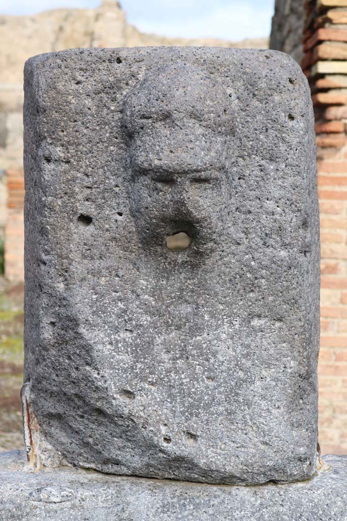 Fountain outside VII.14.13 and VII.14.14 on north side of Via dell’Abbondanza. December 2018.
Head with helmet, possibly a relief of Minerva. Photo courtesy of Aude Durand.