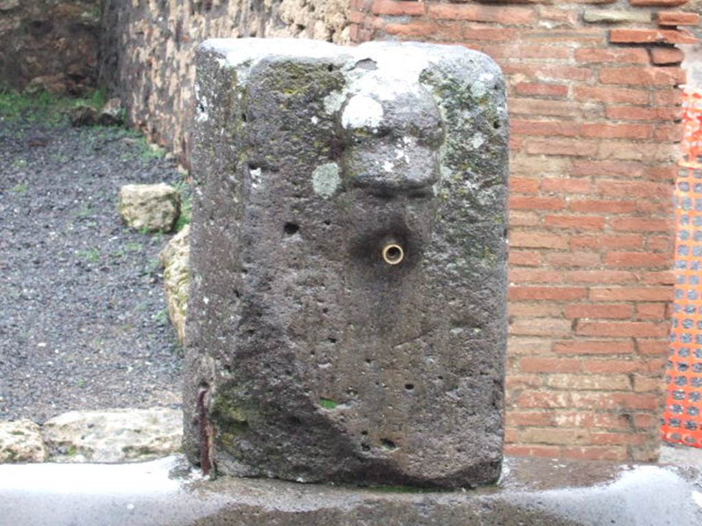 Fountain outside VII.14.13 and VII.14.14 on Via dell’Abbondanza. December 2005.
Head with helmet, possible relief of Minerva.