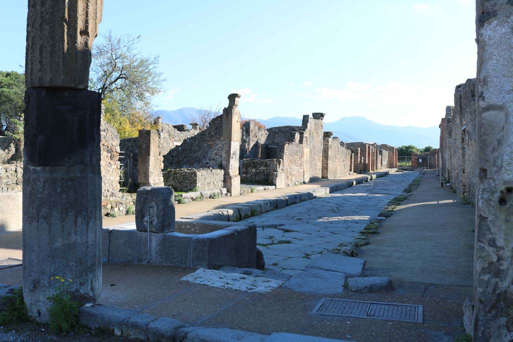 Fountain outside VIII.2.11 on Via delle Scuole, Pompeii. December 2018.
Looking south along east side, between VIII.3, on left, and VIII.2, on right, from the Forum. Photo courtesy of Aude Durand.