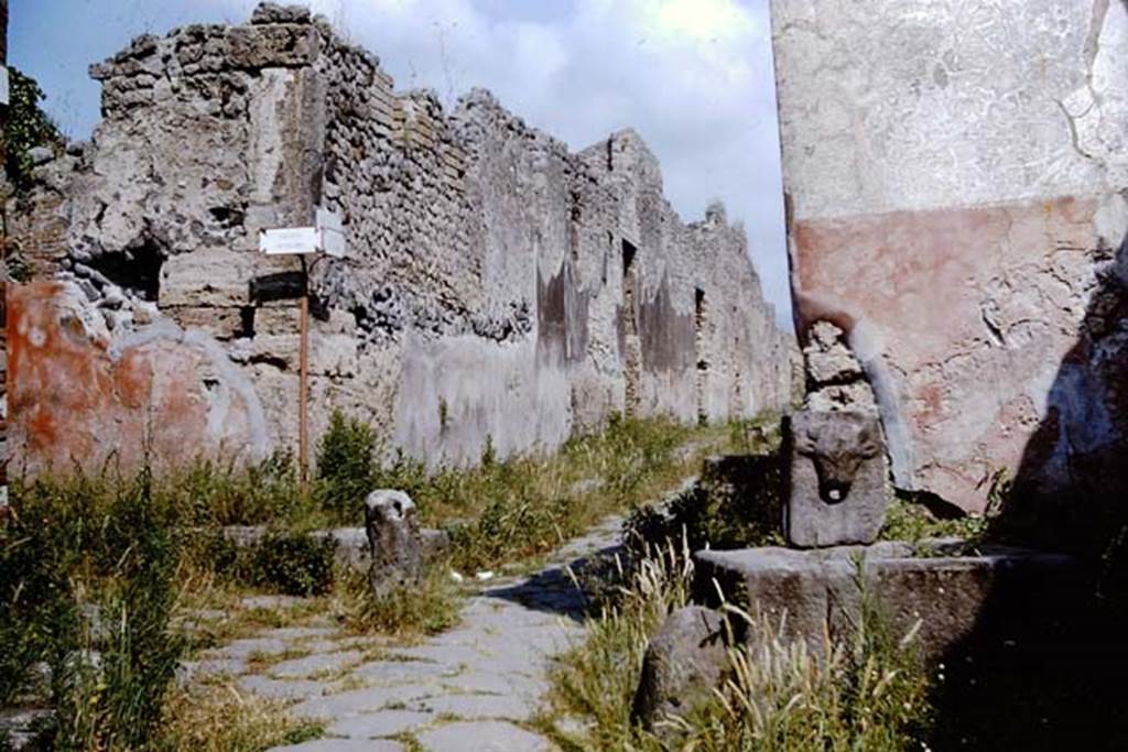 Fountain on Vicolo di Tesmo outside IX.7.17. 1964.
Looking north to junction with Vicolo di Balbo, on the left, and IX.7, on the right at rear of fountain. Photo by Stanley A. Jashemski.
Source: The Wilhelmina and Stanley A. Jashemski archive in the University of Maryland Library, Special Collections (See collection page) and made available under the Creative Commons Attribution-Non-Commercial License v.4. See Licence and use details.
J64f1602