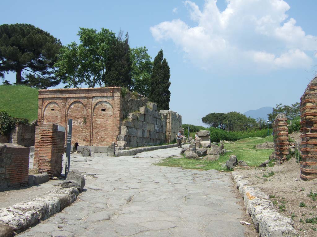 Castellum Aquae Pompeii. May 2006. Looking north from Via del Vesuvio.
Initially most people used wells or collected rainwater in the impluvium of their houses and water supply was not always reliable.
The construction of an aqueduct by Augustus solved this problem, bringing water from Serino in Avellino province.
A branch of the Serino aqueduct brought water to Pompeii.
A water tower or castellum Aquae was built at the highest point in the town next to the Vesuvian Gate.
It was at about 43 metres above sea level in order to make the distribution easier.
It fed a series of water columns with tanks on top which helped maintain pressure and regulate flow.
