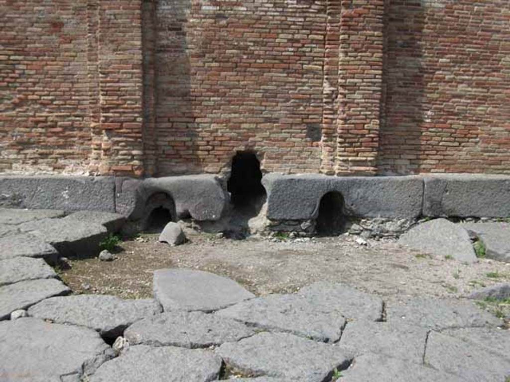 Castellum Acquae Pompeii. May 2010. Three outlets "h" for pipes from water tower. Inside is a cistern which distributed water through three outlets which served different areas of the town.