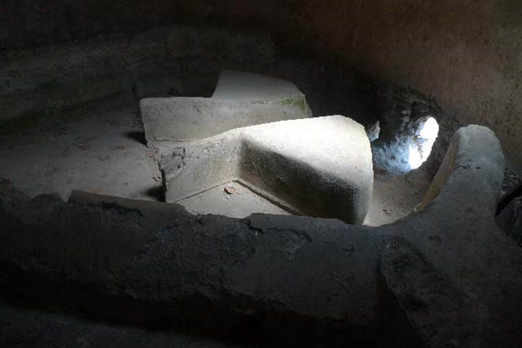 Castellum Aquae Pompeii. July 2010. Basin “B” inside water tower.
Wall b is at the front, and in the basin are directing walls “G” with dividing walls “m” and “m’ “ at their rear.
The three water outlets could be regulated by a means of shutters which could stop the flow of water if lowered.
Lead pipes or fistulae fed water to the public fountains and the public baths and to the houses of wealthy citizens.
Some houses had their own suite of baths or large fountains and fountain ornaments in their gardens.