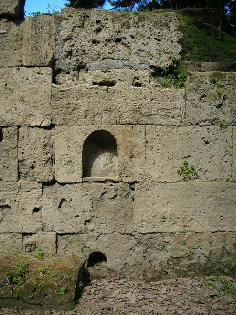 Porta Stabia, Pompeii. May 2010. East wall. Photo courtesy of Ivo van der Graaff.
According to Van der Graaff –
“The partial burial of the altar in the late second century BCE included a ritual deposition placed along its south side.
Among the votive deposits were small votive cups, burnt remains of a sheep/goat vertebra and a pig mandible, and three broken parts of a small terracotta figure (See Fig. 8.3). ………………….
The lack of defining attributes makes any further identification difficult, but her frontal pose is strikingly similar to a statue of Minerva recovered at the Porta Marina, as well as votive figurines related to a regional cult (Note 13).
See Van der Graaff, I. (2018). The Fortifications of Pompeii and Ancient Italy. Routledge, (p.207).
