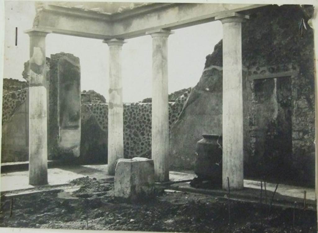 VII.6.28 Pompeii. About 1910. South-west corner of the peristyle.
In the picture can be seen a low wall or threshold of the tablinum, the andron and the doorway to room 7.
Also visible is a masonry altar. This area was devastated by bombing in 1943.
Photograph courtesy of Soprintendenza Speciale per i Beni Archeologici di Napoli e Pompei. Negative number C369.
According to Boyce, near the south-west corner of the peristyle stood a rectangular masonry altar, coated with stucco.
On the top of it, traces of burning were visible at the time of excavation.
He also said that holes found in the earth near the altar were explained by Spano (Not.Scavi) as being the decomposed roots of a large tree.
Spano thought this may have been an arbour sacra, which may have been honoured by sacrifice upon the altar.
See Boyce G. K., 1937. Corpus of the Lararia of Pompeii. Rome: MAAR 14. (p. 67, no. 291)
See Notizie degli Scavi di Antichità, 1910, p. 466f and fig. 9,9a.
