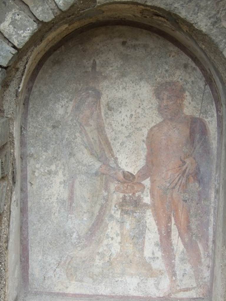 VII.11.14 Pompeii. March 2009. Garden “C”. Lararium. Painting of Genius and Jupiter. See Fröhlich, T., 1991. Lararien und Fassadenbilder in den Vesuvstädten. Mainz: von Zabern. (L.89, T :42.4)