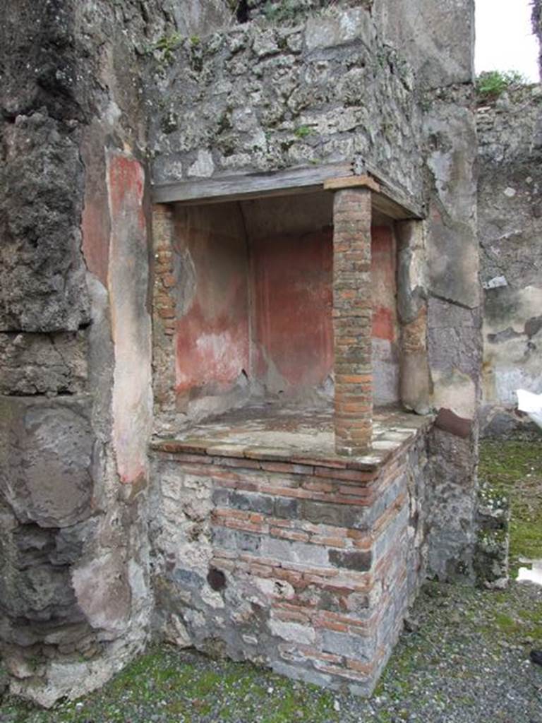 VII.14.5 Pompeii. March 2009. Aedicula lararium in south-west corner of atrium.
According to Boyce-
above a solid podium (1.20 by 1.10, h.1.02) one column and two half columns applied to the south and west walls (h.1.10) supported a roof.
This formed a kind of niche, the ceiling of which was vaulted.
The inside walls were painted red like those of the room.
See Boyce G. K., 1937. Corpus of the Lararia of Pompeii. Rome: MAAR 14. (p.71, no.326)
See Giacobello, F., 2008. Larari Pompeiani: Iconografia e culto dei Lari in ambito domestico. Milano: LED Edizioni, (p.245, no.A28)