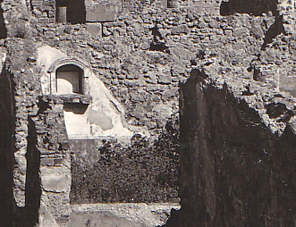 VIII.3.21 Pompeii. Detail of niche and garden from postcard dated 1st August 1939. Photo courtesy of Drew Baker.
According to Boyce-
in the north wall of the garden was an arched niche (h.0.55, w.0.50, d.0.25, h. above floor 1.40) adorned with an aedicula façade.
The façade had a modelled stucco cornice running around the curve of the arch instead of a pediment.
It also had a heavy ledge projecting (0.19) from the surface of the wall.
The inside walls of the niche were covered with white stucco and outlined with red stripes.
See Boyce G. K., 1937. Corpus of the Lararia of Pompeii. Rome: MAAR 14. (p.76, no.356, & Pl.3,5 photo by Warscher).
See Giacobello, F., 2008. Larari Pompeiani: Iconografia e culto dei Lari in ambito domestico. Milano: LED Edizioni, (p.282 no.V73)