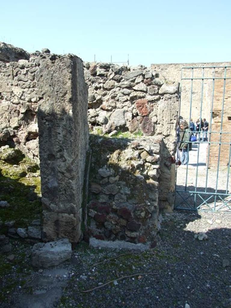 VIII.4.15 Pompeii. March 2009. Room 1, atrium. Remains of altar base in north-west corner of atrium.
According to Boyce –
Upon a masonry base (1.15 by 0.85, h. 1.25), called una specie di altare con nicchia disopra, built into the north-west corner of the atrium,
were painted several figures grouped about a tripod, among them the Genius with a patera and opposite him, the popa with an axe.
See Boyce G. K., 1937. Corpus of the Lararia of Pompeii. Rome: MAAR 14. (p.76, no. 362.
See Giacobello, F., 2008. Larari Pompeiani: Iconografia e culto dei Lari in ambito domestico. Milano: LED Edizioni, (p.200, no.91).