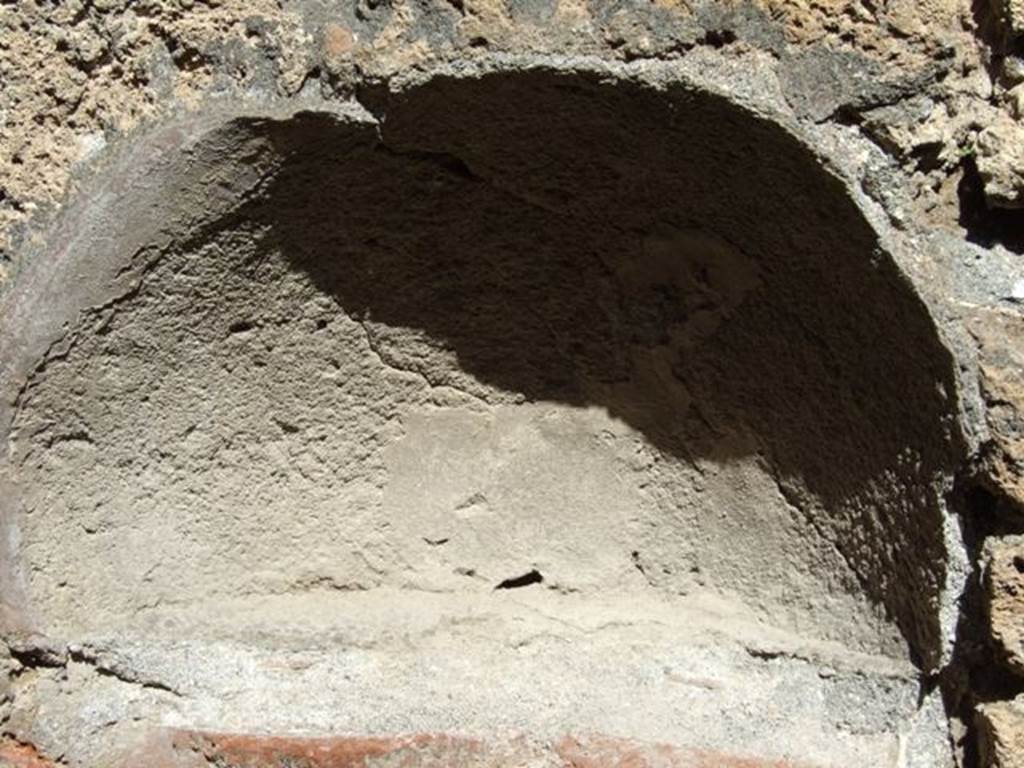 VIII.5.9 Pompeii. March 2009. Room 21, niche in north wall.
According to Boyce –
this arched niche (h.0.45, .0.65, d.0.27, h. above floor 0.90), in the north wall near the hearth, was called a lararium in the reports.
See Boyce G. K., 1937. Corpus of the Lararia of Pompeii. Rome: MAAR 14. (p.77, no.370).
Boyce gives the references Not. Scavi, 1881, 323; Bull. Inst., 1883, 177.
See Giacobello, F., 2008. Larari Pompeiani: Iconografia e culto dei Lari in ambito domestico. Milano: LED Edizioni, (p.201, no.93).