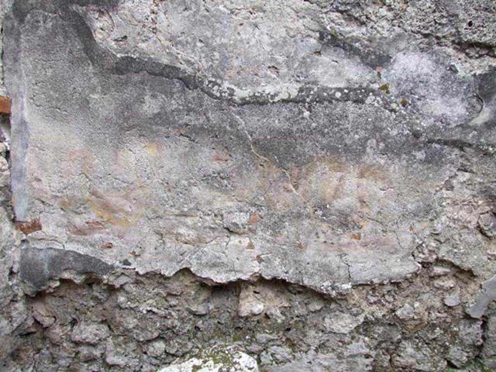 IX.1.12 Pompeii. December 2007. Room in north west corner next to corridor. Kitchen. Is this the remains of the two painted snakes recorded by Helbig? See Helbig, W., 1868. Wandgemälde der vom Vesuv verschütteten Städte Campaniens. Leipzig: Breitkopf und Härtel. (66).