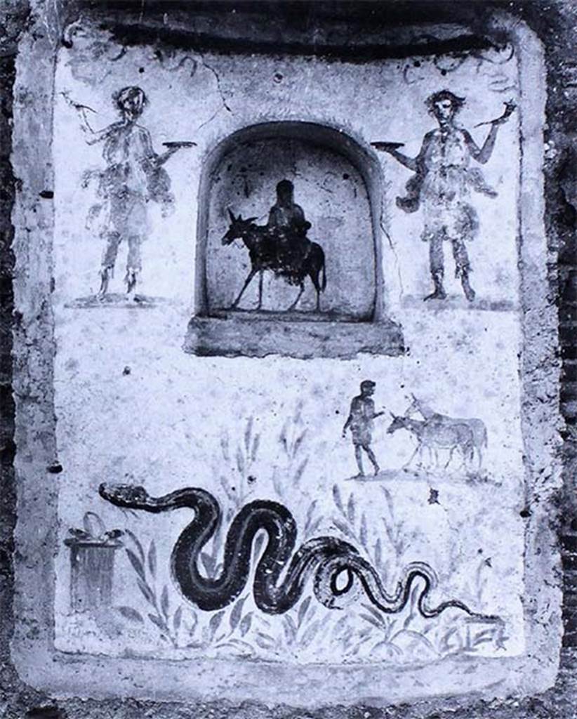 IX.2.24 Pompeii. Old photo of lararium and niche on west wall of stable.
According to Fröhlich, on the lower left was a painted altar with a snake approaching, through plants, from the right.
Above right was a man leading two donkeys.
In the niche was a female figure on a donkey, perhaps Vesta, Epona or Isis-Epona.
Two Lares were at the top, one on either side of the niche.
See Fröhlich, T., 1991, Lararien und Fassadenbilder in den Vesuvstädten. Mainz: von Zabern. (L99: p.293, T. 42,3).