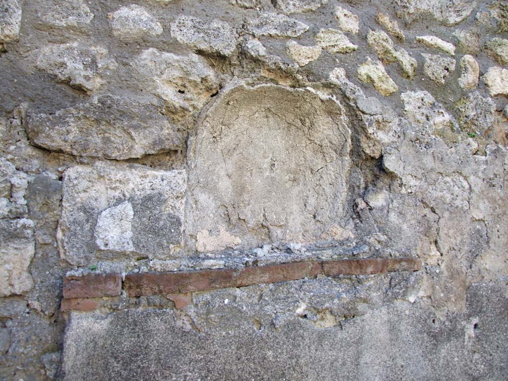 IX.3.2 Pompeii. March 2009. Niche on west wall of kitchen, latrine, cella penaria and well or fountain room.
Boyce described this as the ruins of an arched niche.
See Boyce G. K., 1937. Corpus of the Lararia of Pompeii. Rome: MAAR 14. (p. 82, 407B)