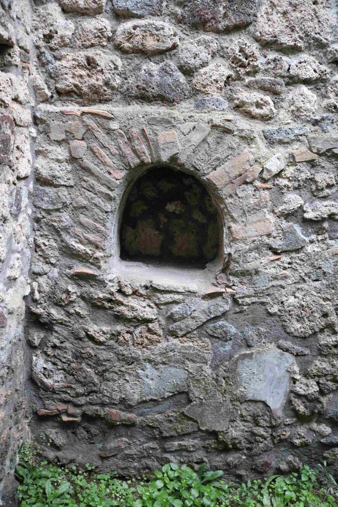 IX.3.13 Pompeii. December 2018. Kitchen, niche on north wall. Photo courtesy of Aude Durand.
According to Boyce, in the kitchen behind the shop, in the north wall is an arched niche (h.0.45, w.0.45, d.0.20, h. above floor 1.05).
See Boyce G. K., 1937. Corpus of the Lararia of Pompeii. Rome: MAAR 14. (p.84, no.412).