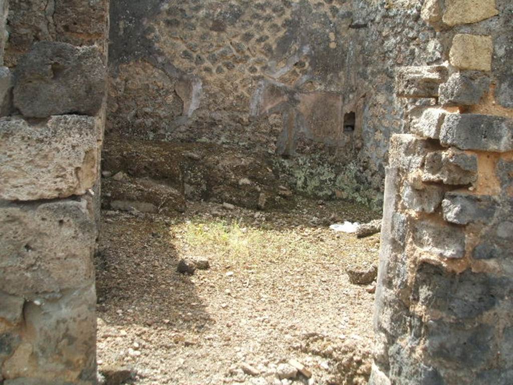 IX.6.3 Pompeii. May 2005. Doorway to kitchen area, “i” looking south.
According to Boyce –
on the east wall (not photographed) was a lararium painting, (h. uncertain as the upper part was damaged when found w.1.32).
An altar stood between the Genius on the right, and the tibicen on the left.
On each side was a Lar with rhyton and situla standing between two shrubs.
In the lower zone were two serpents confronted at an altar furnished with two eggs.
See Boyce G. K., 1937. Corpus of the Lararia of Pompeii. Rome: MAAR 14. (p.86, no.428)
See Sogliano, A., 1879. Le pitture murali campane scoverte negli anni 1867-79. Napoli: (p.12, no. 25)
According to Giacobello, today the painting has been totally lost.
See Giacobello, F., 2008. Larari Pompeiani: Iconografia e culto dei Lari in ambito domestico. Milano: LED Edizioni. (p.209, no.104)