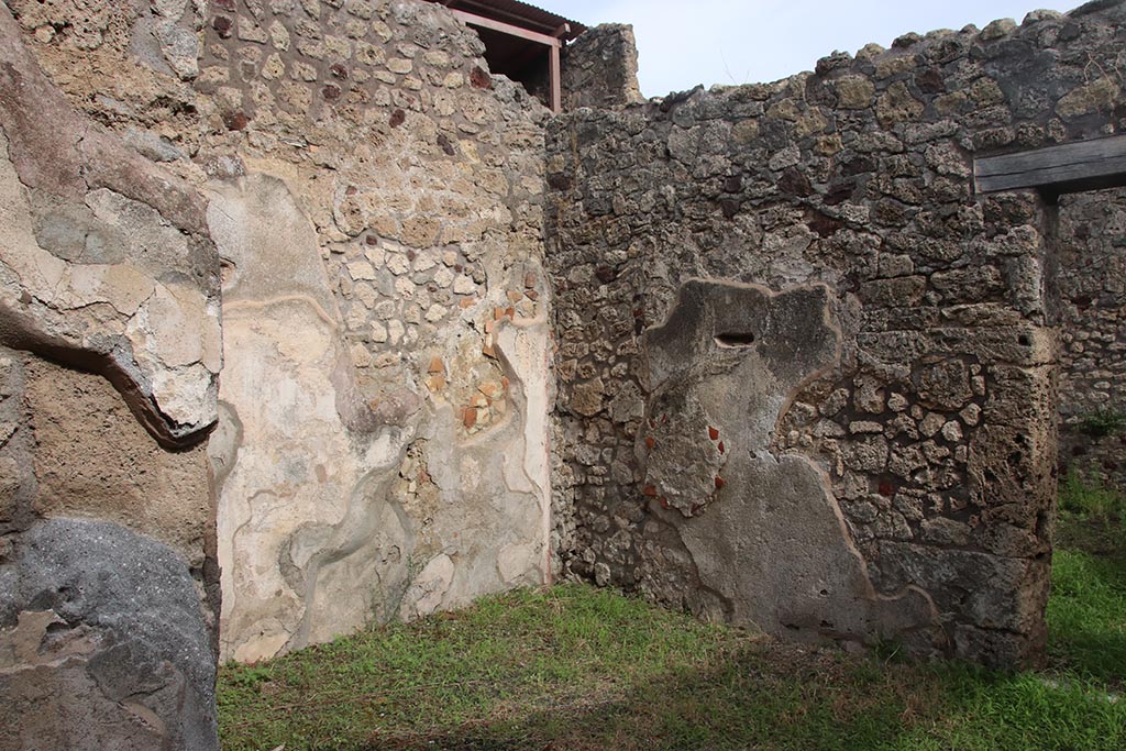IX.7.19 Pompeii. October 2024. Looking north-east in ala c towards east wall, on right. Photo courtesy of Klaus Heese.
According to Boyce, on the east wall of the left ala, a fragment of a lararium painting was seen at the time of excavation.
The fragment represented a single serpent moving amongst foliage.
See Boyce G. K., 1937. Corpus of the Lararia of Pompeii. Rome: MAAR 14. (p.88, no.437)
See Fröhlich, T., 1991. Lararien und Fassadenbilder in den Vesuvstädten. Mainz: von Zabern. (p.112).