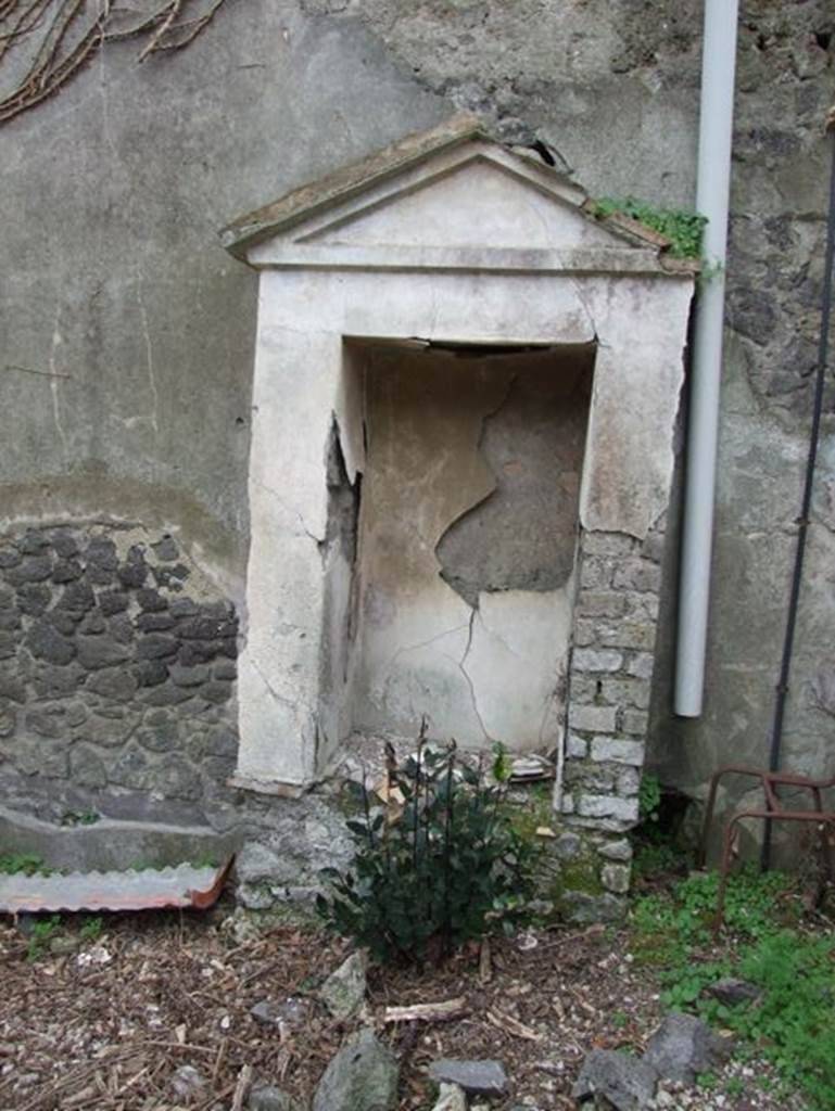 IX.7.20 Pompeii. December 2007. Aedicula with niche on north side of fountain, looking west.
According to Boyce -
When excavated this one, found on the north side (to the right) contained the following terracotta statues –
Asclepius with snake, Bacchus with a leopard, a clothed woman holding a bird, and fragments of a fourth – perhaps Minerva.
Also found was a small terracotta bird resembling a dove on a cylindrical base.
See Boyce G. K., 1937. Corpus of the Lararia of Pompeii. Rome: MAAR 14. (p. 89, no.446)
See Jashemski, W. F., 1993. The Gardens of Pompeii, Volume II: Appendices. New York: Caratzas. (p.242-3, no.504, location given as IX.7.25).
According to Kuivalainen, one of the group of terracotta figures, Bacchus (Now in Naples Archaeological Museum, inventory number 116664), was discovered with traces of colour; the left hand of the youth and the head of the animal are missing.
Kuivalainen comments –
The figurine follows the customary model of the marble statues depicting a young Bacchus giving wine to a panther. It was not, however, a popular subject as a terracotta figurine, nor in bronzes. As it was discovered in a lararium it surely had religious meaning.
See Kuivalainen, I., 2021. The Portrayal of Pompeian Bacchus. Commentationes Humanarum Litterarum 140. Helsinki: Finnish Society of Sciences and Letters, (H11, p.217).