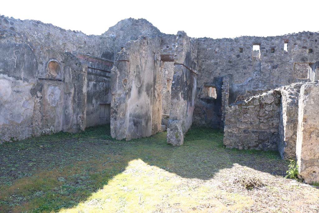 IX.8.b Pompeii. February 2020.
Looking south-west across atrium, towards niche in south wall, on left, and entrance doorway in west wall, in centre.
Photo courtesy of Aude Durand.
