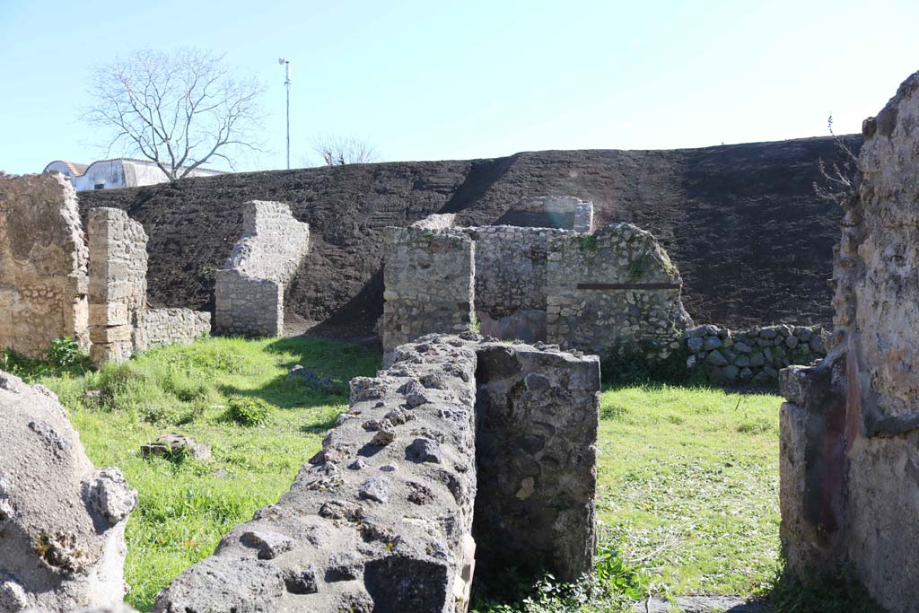 IX.8.c Pompeii. February 2020.
Looking from rooms on north side across peristyle towards a room on south side, and into the unexcavated. Photo courtesy of Aude Durand.