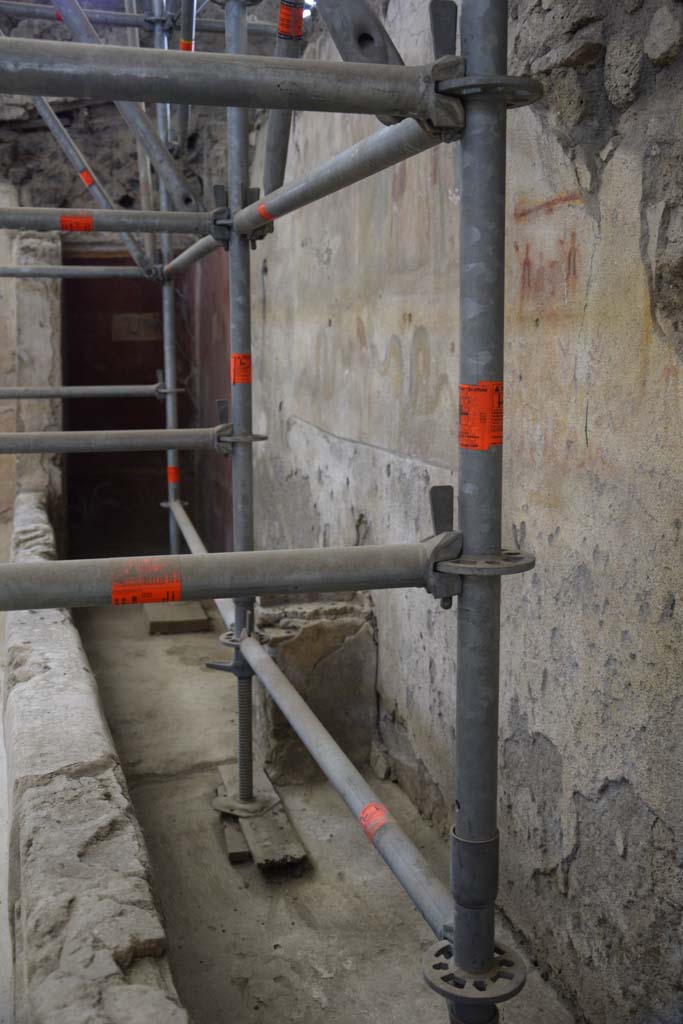 IX.12.6 Pompeii. February 2017.
Room "n1", looking south along west wall towards lararium with altar below. Photo courtesy of Johannes Eber.