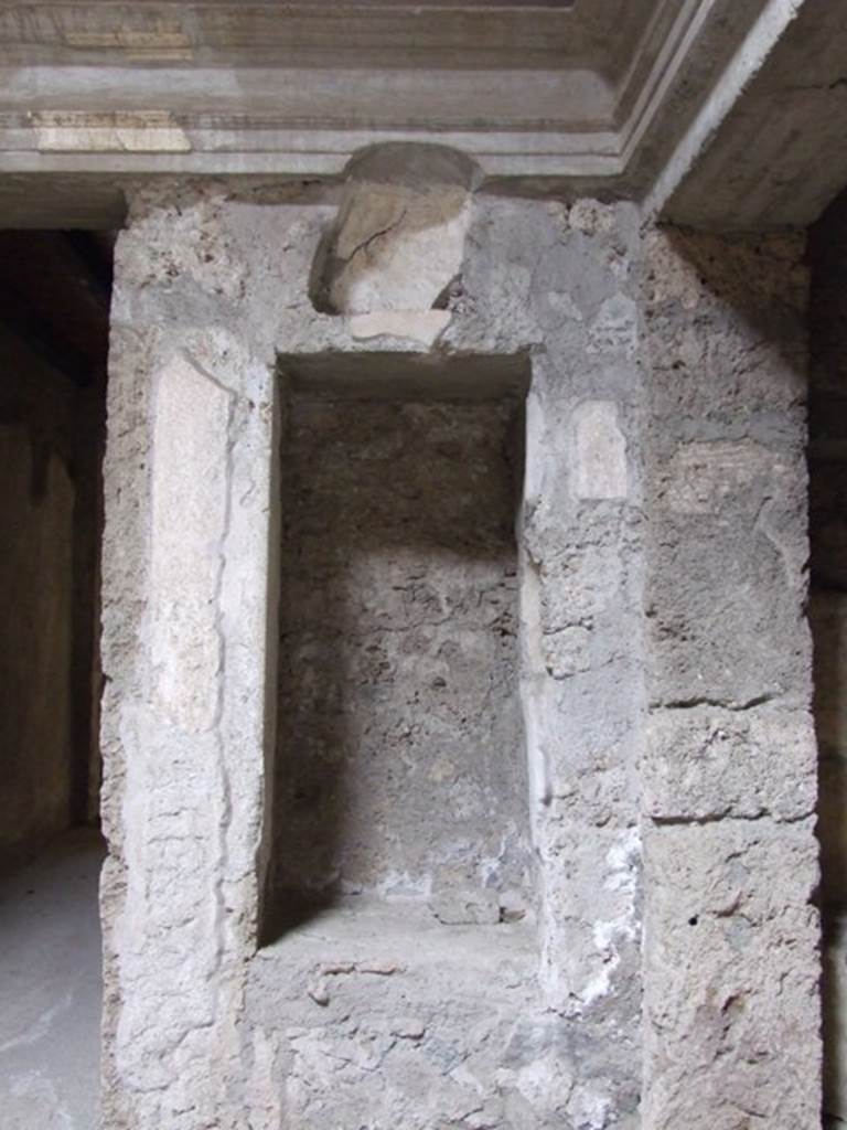 IX.13.1-3 Pompeii. March 2009. Room 2, north-east corner of atrium.
Recess with 2 niches.