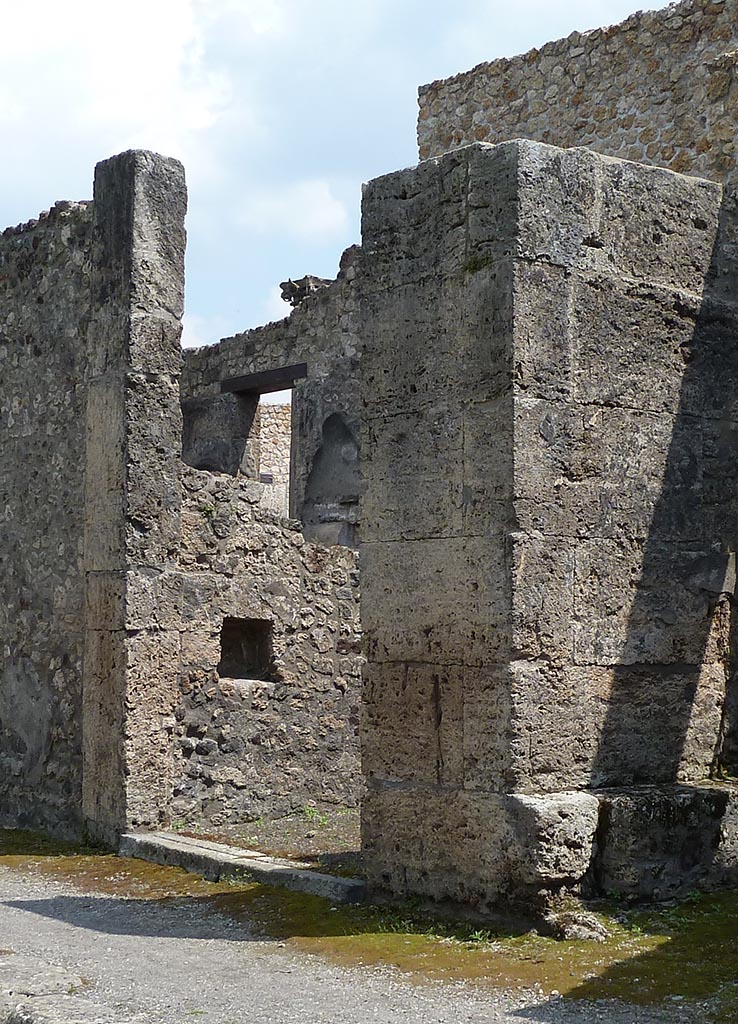 IX.14.3 Pompeii. May 2010. Entrance doorway looking to east wall.
According to Boyce, in the east wall was a square niche painted white within.
See Notizie degli Scavi di Antichità, 1911, 351.
Boyce gives the location as Reg. III, Taberna located to the east of the entrance into the smaller atrium of Domus Obelli Firmi.
See Boyce G. K., 1937. Corpus of the Lararia of Pompeii. Rome: MAAR 14. (p. 31, no. 69)