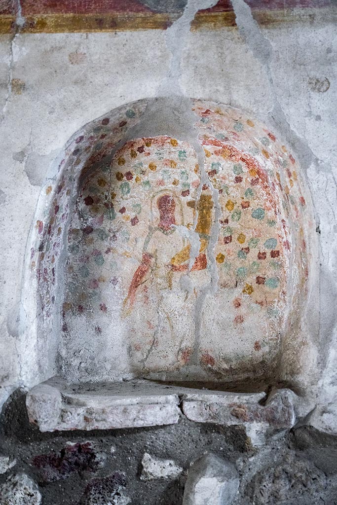 IX.14.4 Pompeii. July 2024.
Detail of painted niche of lararium set into south wall of kitchen. Photo courtesy of Johannes Eber.