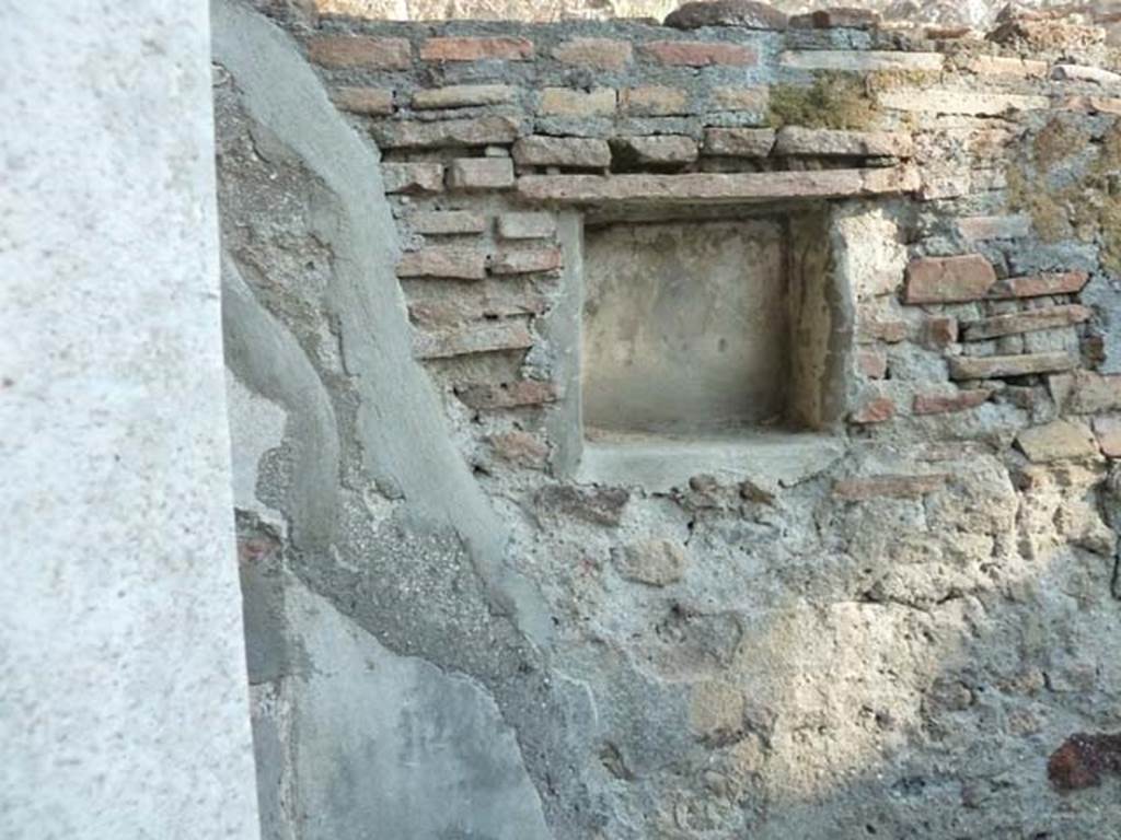 HGW25 Pompeii. September 2015. Lararium in south wall, with remains of a painted Fortuna with rudder and cornucopia.
No 67, 68 and 69 on the La Vega plan –
From PAH 1,1, p.272-3, 1st May 1773: (addendum p.129 and 159 – original at end of photos): (La Vega: 67, 68, 69).
After having worked for many weeks to lift the earth from around the rustic courtyard of the said dwelling, we have entirely freed two rooms near to the said courtyard. Although, these have very ordinary floors and everything poorly arranged, they are not worth mentioning having some ordinary paintings decorated with panels.
These (rooms) would have been used by the servants of the owners, because of the worktools found used to cultivate the soil, and for cooking, and for the large quantity of ordinary vessels that there were, that is to say water-jugs, pots of many sorts well smoked, and caraffes, many of which were found broken.
The entire things found in the indicated rooms were - (see page 273 for the list of the finds, Bronze, Glass, Terracotta)
In the entrance of the courtyard, there was a small room with the usual; and in a small niche of the same room, there was a painted Fortuna, as one could see by the rudder and the horn of plenty. Above this room, there was a partition with burnt straw, of which…. (della quale si son fatti prendere alcuni massi)