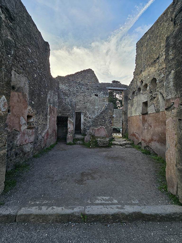 II.2.3 Pompeii. November 2024.
Looking south across bar-room, with niches in east and west walls. Photo courtesy of Annette Haug.