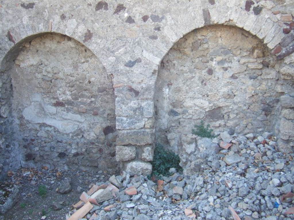 VI.9.2 Pompeii. September 2004. Room 38, west wall of kitchen. The lararium painting was found in an area marked “u” on a plan by Overbeck. This would coincide with the arched area on the right.