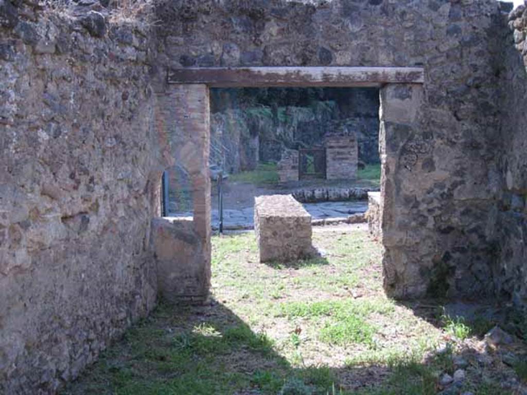 I.1.2 Pompeii. September 2010. Looking west from rear room, across bar-room to Via Stabiana. Photo courtesy of Drew Baker.
According to Mau, this room would have been decorated with a zoccolo mainly painted red, the middle of the walls would have been painted yellow, and the upper parts were white. On the south wall (on the left) would have been the painting showing Phryxus and the death of Helle.