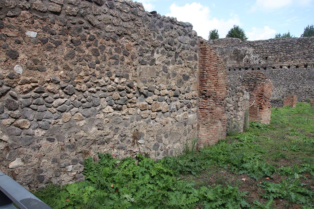 I.1.3 Pompeii, October 2024.
North wall of room “a”, with north wall of room “b” with doorway into I.1.4, centre right. Photo courtesy of Klaus Heese.