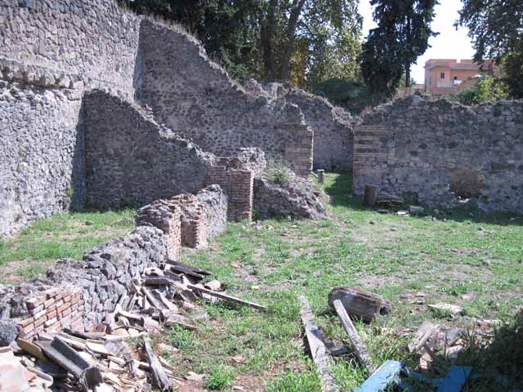 I.1.3 Pompeii. September 2010.
Rear area of yard “c” and stables “d”, looking south to doorway to second stables area behind I.1.2. Photo courtesy of Drew Baker.