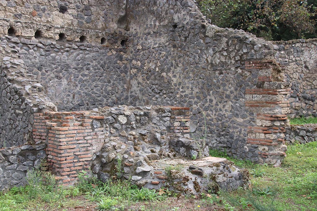 .1.3 Pompeii, October 2024. Looking towards east wall, south-east corner and south wall of kitchen “f”.
On the right is the doorway into area “g”, the second stables area behind I.1.2. Photo courtesy of Klaus Heese.