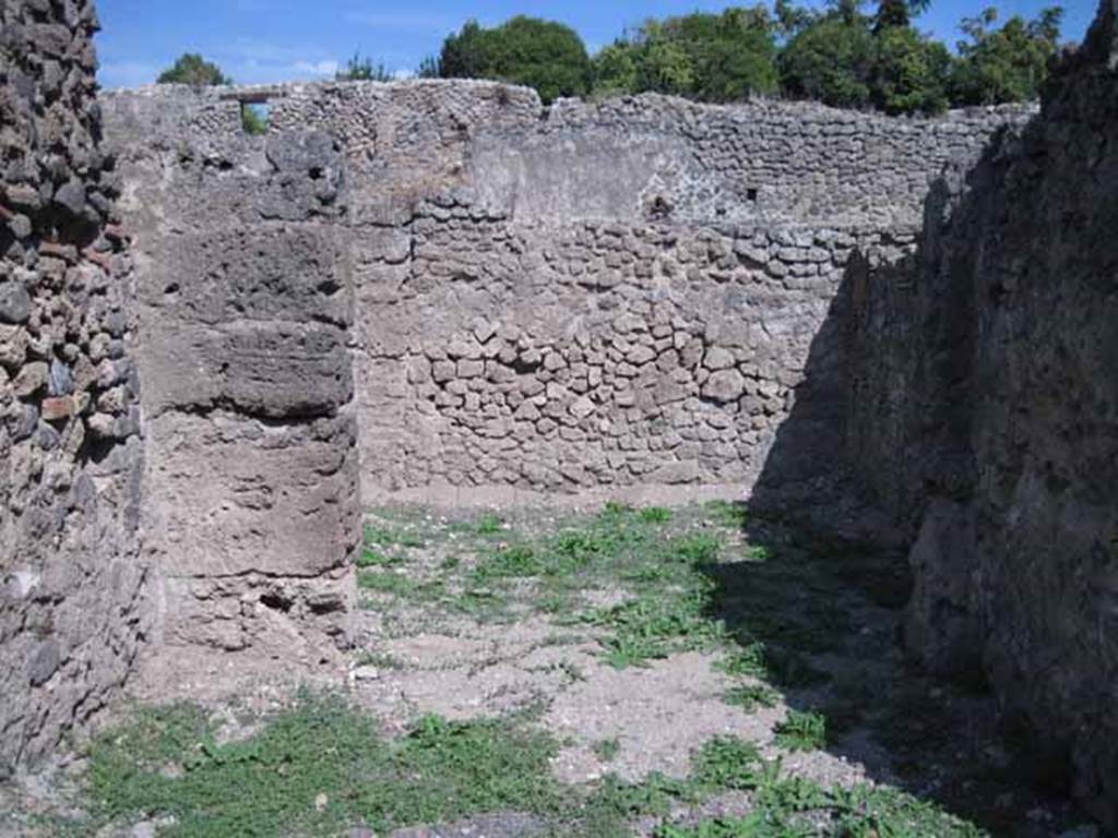 I.1.5 Pompeii. September 2010. Looking east into rear room, from shop-room. Photo courtesy of Drew Baker.