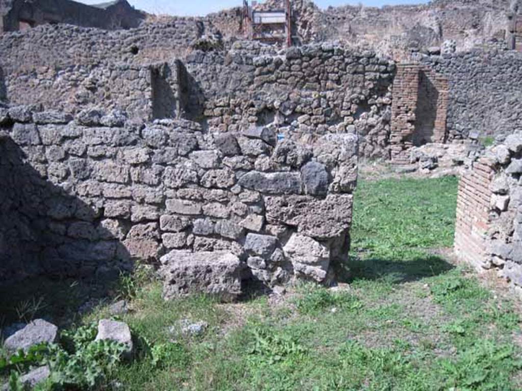 I.1.8 Pompeii. September 2010. North wall of small room, with doorway to large entrance room. Photo courtesy of Drew Baker.