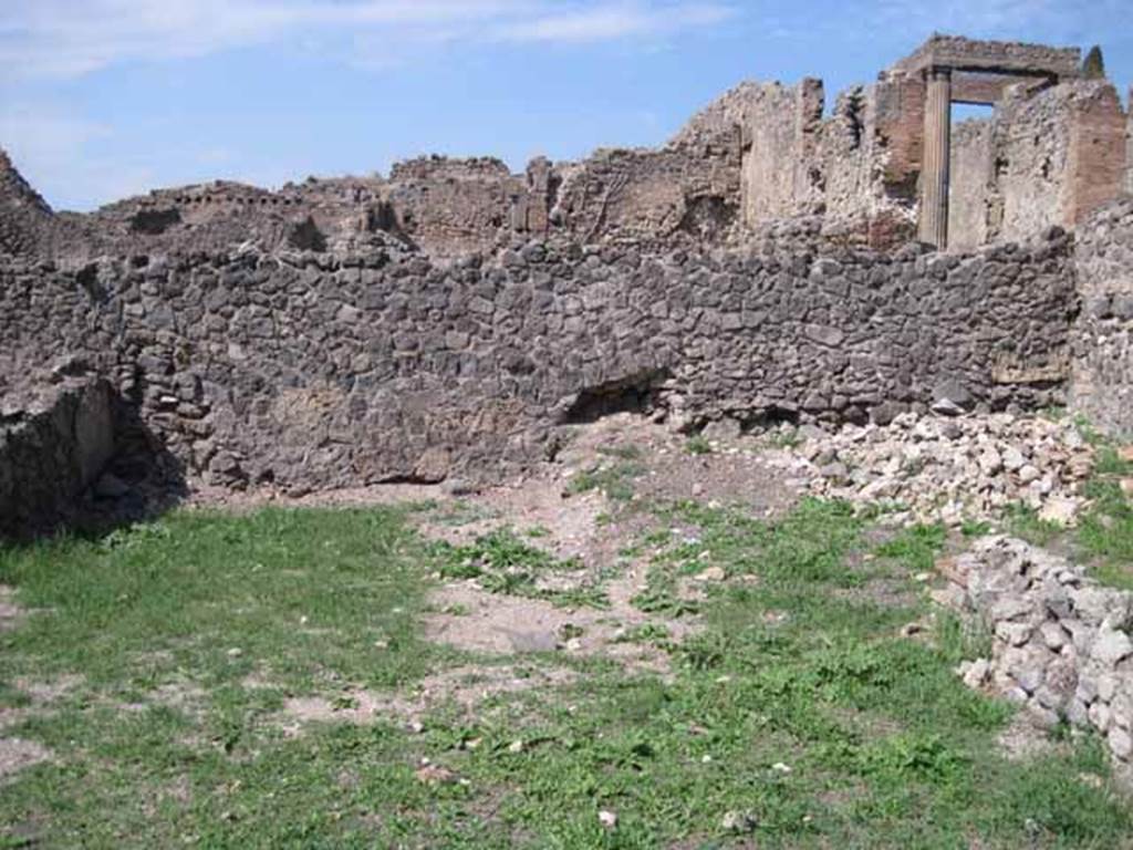 I.1.8 Pompeii. September 2010. North wall and north-west corner of yard. Photo courtesy of Drew Baker. Originally this would have been the site of other rooms. These were bombed in 1943, destroying the internal walls and part of the north perimeter wall. See Garcia y Garcia, L., 2006. Danni di guerra a Pompei. Rome: L’Erma di Bretschneider. (p.37)