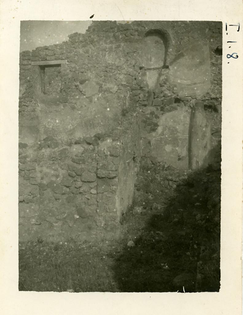 I.1.8 Pompeii. Pre-1937-39. Looking towards two rooms against the north wall.
According to Warsher –
“In the above photo, one could still see the latrine situated on the upper floor, and a brick pipe from a third latrine, which was even higher up on the wall”. The pipe can be seen on the right.
Photo courtesy of American Academy in Rome, Photographic Archive. Warsher collection no. 001.