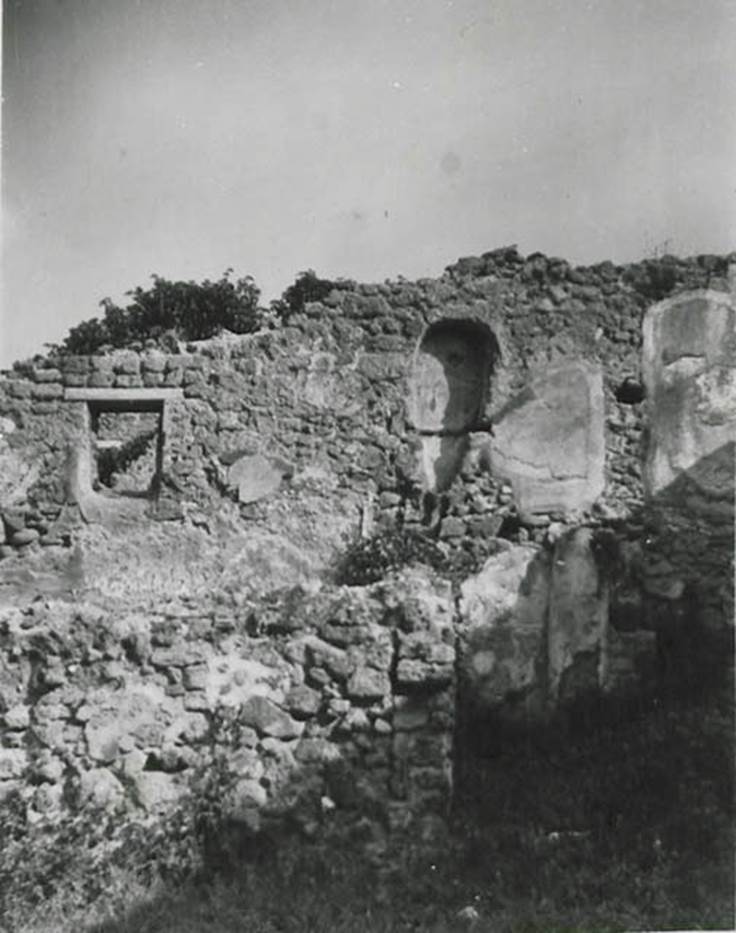 10108-warscher-codex-81-640.jpg
I.1.8 Pompeii. 1936, taken by Tatiana Warscher. Looking towards north wall.
According to Warscher, quoting Mau in Bull. Inst. 1875, p.30/31, along the north wall there were two rooms with windows overlooking the northern vicolo (now named Vicolo del Conciapelle), and a latrine nearer the stables at the north-east end. In the above photo, one could still see the latrine, situated on the upper floor, and a brick pipe from a third latrine, which was even higher up on the wall. See Warscher T., 1936. Codex Topographicus Pompeianus: Regio I.1, I.5. (no.15), Rome: DAIR, whose copyright it remains.